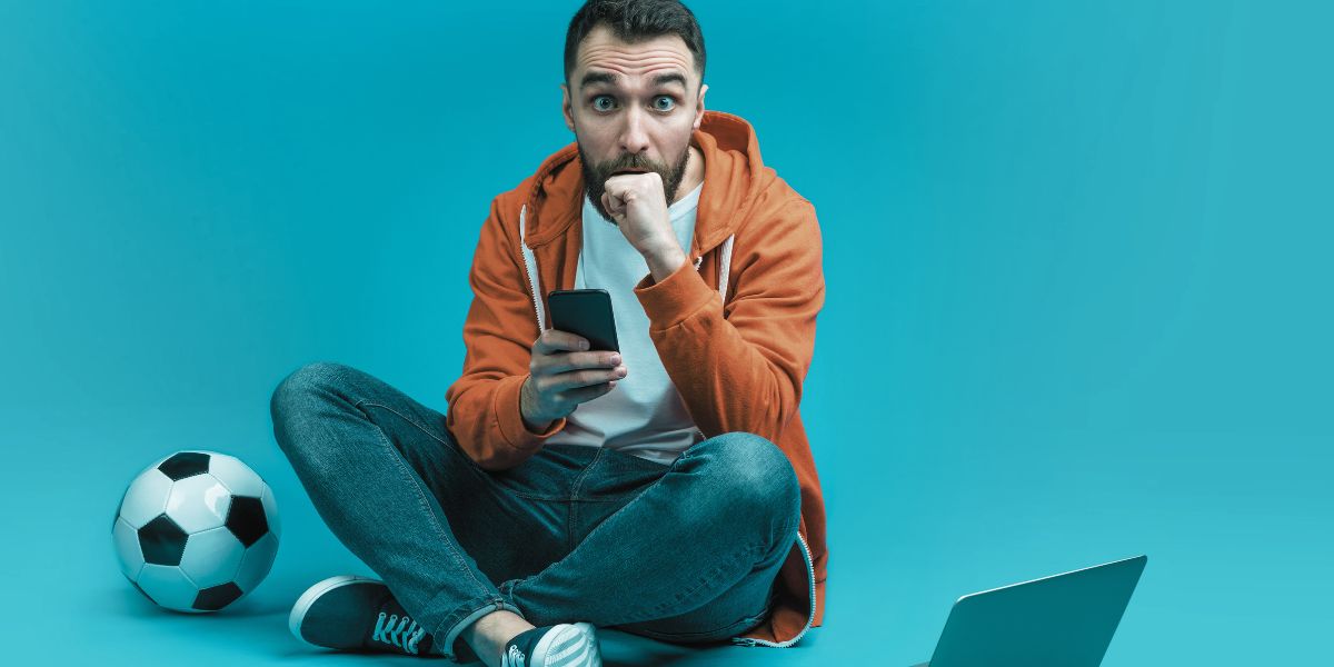 Homme qui vient de vivre une action de football intense - Le Bon Parieur